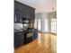 Bright kitchen with dark appliances and hardwood floors at 11215 Idlewild Rd, Matthews, NC 28105