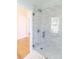 Glass shower with shower head and subway tile at 11215 Idlewild Rd, Matthews, NC 28105