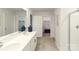 Bathroom showcasing double vanity with a view into the walk-in closets and stand-up shower at 125 Meadow View Dr, Statesville, NC 28677