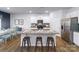 Modern kitchen boasts granite countertops, stainless steel appliances, and eat-in island with stool seating at 125 Meadow View Dr, Statesville, NC 28677