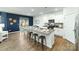 Modern kitchen boasts granite countertops, stainless steel appliances, and eat-in island with stool seating at 125 Meadow View Dr, Statesville, NC 28677