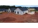 New home with black roof and white siding, and large yard at 1370 Coppergate Dr, Salisbury, NC 28147