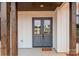 Close up view of the attractive gray double front doors with glass panels and stylish hardware at 1370 Coppergate Dr, Salisbury, NC 28147