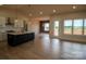 Open-concept kitchen and living area with a large island, stainless steel appliances, and hardwood floors at 1370 Coppergate Dr, Salisbury, NC 28147