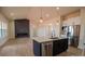 An open-concept kitchen and living room with a fireplace and modern finishes at 1370 Coppergate Dr, Salisbury, NC 28147