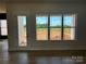Bright living room with a view of the landscape and direct access to the outdoors at 1370 Coppergate Dr, Salisbury, NC 28147