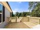 Newly built wood deck with stairs and railings off the back of the home at 141 Lakewind Dr, Mooresville, NC 28115