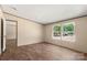 Comfortable bedroom with wood-look floors and natural light, creating a relaxing space for rest and rejuvenation at 141 Lakewind Dr, Mooresville, NC 28115