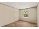 Bright bedroom featuring wood-look flooring and a window providing natural light at 141 Lakewind Dr, Mooresville, NC 28115