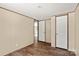 A bedroom with wood-look floors, paneled walls, white doors and trim at 141 Lakewind Dr, Mooresville, NC 28115
