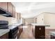 Bright kitchen featuring wood cabinets, modern appliances, and ample counter space, perfect for cooking at 141 Lakewind Dr, Mooresville, NC 28115