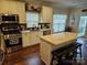 Bright kitchen with stainless steel appliances, granite countertops, and center island with seating at 14117 Hiawatha Ct, Huntersville, NC 28078