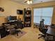 Bright, carpeted home office space offering lots of room for multiple desks, work spaces, and storage at 14117 Hiawatha Ct, Huntersville, NC 28078