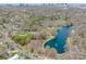 Stunning aerial view showcasing a lake, baseball field, and cityscape in the background at 1623 Geneva Ct, Charlotte, NC 28209