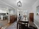 Open concept dining area with hardwood floors, seamlessly connected to the kitchen, great for entertaining at 1623 Geneva Ct, Charlotte, NC 28209