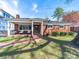 Brick facade with covered porch and classic design elements, offering timeless curb appeal at 1623 Geneva Ct, Charlotte, NC 28209