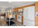 Cozy kitchen featuring wood cabinets, white appliances, and eye-catching tiled backsplash at 2012 Oakstone Dr, Monroe, NC 28110