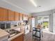 Functional kitchen with white appliances and a sliding door to the backyard at 2012 Oakstone Dr, Monroe, NC 28110