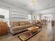 Cozy living room featuring hardwood floors, natural light, and comfortable furnishings at 2012 Oakstone Dr, Monroe, NC 28110