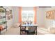 Well-lit bedroom featuring a comfortable workspace with a large window and stylish orange chevron curtains at 203 Giant Oak Ave, Statesville, NC 28677