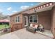 Inviting covered patio featuring brickwork, lounge seating, and awning, perfect for relaxing and outdoor enjoyment at 205 Cowboys Cir, Rock Hill, SC 29732