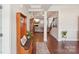 Inviting entryway with hardwood floors, wooden furnishings and seamless transition to an open-concept living area at 205 Cowboys Cir, Rock Hill, SC 29732