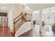 Welcoming foyer featuring hardwood floors, staircase with decorative iron railings, and natural light at 205 Cowboys Cir, Rock Hill, SC 29732