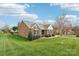 Beautiful single story brick home with manicured lawn and landscaping; wrought iron fence in backyard at 205 Cowboys Cir, Rock Hill, SC 29732