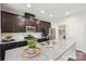 Modern kitchen with dark cabinets, granite countertops, and stainless appliances at 205 Cowboys Cir, Rock Hill, SC 29732