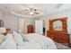 Spacious main bedroom boasts tray ceiling, ceiling fan, and natural wood furniture at 205 Cowboys Cir, Rock Hill, SC 29732