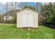 Back yard features a well-maintained storage shed with double doors, providing ample space for storing equipment at 205 Cowboys Cir, Rock Hill, SC 29732