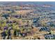 Wide aerial view of a neighborhood highlighting nearby amenities such as schools and parks at 210 W Lee Ave, Bessemer City, NC 28016