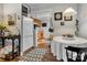 Dining room adjacent to kitchen with modern chandelier and neutral tones at 210 W Lee Ave, Bessemer City, NC 28016