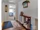 Hallway to craft room with access to foyer and side entrance at 210 W Lee Ave, Bessemer City, NC 28016