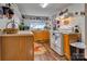 Eat-in kitchen with linoleum floors and updated appliances and lots of shelving at 210 W Lee Ave, Bessemer City, NC 28016