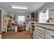 Bright room with sewing station featuring large windows, overhead lighting and built-in craft storage at 210 W Lee Ave, Bessemer City, NC 28016