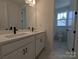 Modern bathroom features a double vanity with sleek black fixtures and marble flooring at 255 Luray Way # 442, Rock Hill, SC 29730