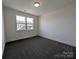 Cozy bedroom with a large window and plush gray carpet at 255 Luray Way # 442, Rock Hill, SC 29730