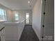 Upstairs hallway with neutral carpet and natural light, leading to a balcony at 255 Luray Way # 442, Rock Hill, SC 29730