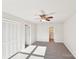 Bedroom with closet, ceiling fan, neutral walls, and gray carpet at 2611 Rolling Hills Dr, Monroe, NC 28110