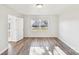 Bright bedroom with hardwood floors, a window, white walls and white trim at 2611 Rolling Hills Dr, Monroe, NC 28110