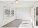 Bedroom with carpet, a window overlooking a yard, and a closet with louvered doors at 2611 Rolling Hills Dr, Monroe, NC 28110