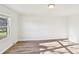 Bright bedroom with hardwood floors, a window, white walls and white trim at 2611 Rolling Hills Dr, Monroe, NC 28110