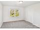 Bedroom with carpet, a window overlooking a yard, and a closet with louvered doors at 2611 Rolling Hills Dr, Monroe, NC 28110