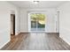 Dining Room features hardwood floors, white walls, and a door to the backyard at 2611 Rolling Hills Dr, Monroe, NC 28110