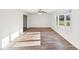 Living Room features hardwood floors, a ceiling fan, a window, and white walls at 2611 Rolling Hills Dr, Monroe, NC 28110