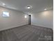 Spacious carpeted basement with recessed lighting and a window at 263 Luray Way # 444, Rock Hill, SC 29730