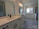 Bathroom featuring stone countertops, sleek black hardware, tiled floors, and glass enclosed shower at 263 Luray Way # 444, Rock Hill, SC 29730