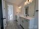 Bathroom featuring stone countertops, sleek black hardware, tiled floors, and double vanity at 263 Luray Way # 444, Rock Hill, SC 29730