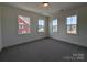 Bright bedroom featuring plush carpet, three large windows allowing ample natural light to fill the room at 263 Luray Way # 444, Rock Hill, SC 29730